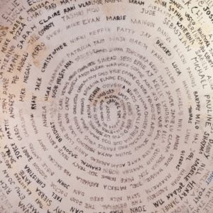 8. A-righteous-cause-Free-Santorini-from-its-sunset-fame-Rent-A-Greek-Villa Spyral writting part of the decor on the ceiling of the Atlantis bookstore in Oia Santorini