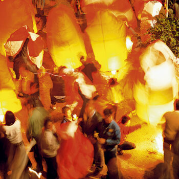 Leonidio paper lanterns | Easter in Greece People lighting and setting free paper latenrs in Leonidio. This is part of a unique collection of local Greek customs for celebrating a tradition Easter in Greece