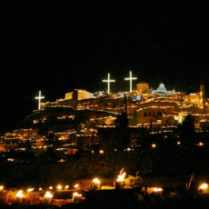 The village of Pyrgos in Santorini as seen from afar on Good Friday. custom made candles are scatterd throughout the village, even on the rooftops and are lit as the Epitaph goes through the village, as part of celebrating Easter in Greece