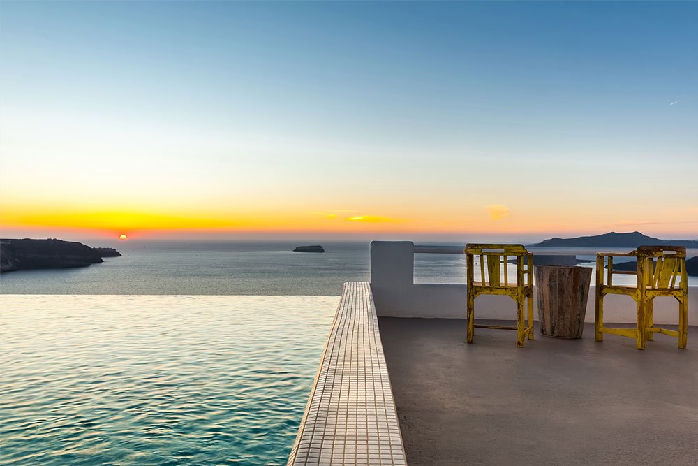How to choose the best luxury villa in Santorini The sunset as seen from a luxury villa in Santorini included in the blog post how to choose a villa in Santorini
