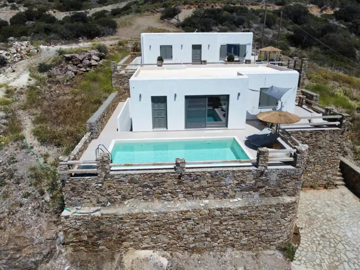 Aerial view of the summer Villa Manta in Antiparos, featuring two pools and two independent houses.